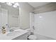 A modern bathroom featuring a vanity with sink, toilet, and a shower-tub combination with a shower curtain at 1027 Regency Dr, Acworth, GA 30102