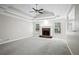 Spacious living room featuring a brick fireplace, recessed lighting, and a ceiling fan at 1027 Regency Dr, Acworth, GA 30102