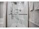 Modern bathroom featuring a glass shower door, rainfall shower head and marble tiled walls at 1067 Brownstone Dr # 23, Marietta, GA 30008