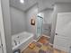 Bathroom with a soaking tub, glass-enclosed shower, and neutral colors, creating a serene and spa-like atmosphere at 1067 Brownstone Dr # 23, Marietta, GA 30008