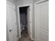 Neutral bathroom view from the hall, with view of tile floors and shower at 1067 Brownstone Dr # 23, Marietta, GA 30008