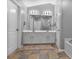 Bathroom featuring tile floors, neutral paint, and a large mirror at 1067 Brownstone Dr # 23, Marietta, GA 30008