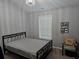 Cozy bedroom with a decorative chandelier, window and artwork for a relaxing retreat at 1067 Brownstone Dr # 23, Marietta, GA 30008