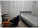 Bedroom featuring a bed, desk, and chair; ideal for a guest room or home office at 1067 Brownstone Dr # 23, Marietta, GA 30008