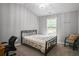 Bedroom featuring carpet floors, neutral paint, a ceiling fan, and a chair at 1067 Brownstone Dr # 23, Marietta, GA 30008