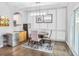 Dining area with modern lighting, wainscoting, and access to a patio at 1067 Brownstone Dr # 23, Marietta, GA 30008