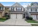 Charming townhouse with brick accents, attached two-car garage, and well-maintained landscaping at 1067 Brownstone Dr # 23, Marietta, GA 30008