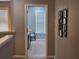 Second floor hallway with a view to the bedroom, featuring plush carpeting and framed photos at 1067 Brownstone Dr # 23, Marietta, GA 30008