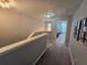 Upstairs hallway featuring neutral carpet and gray paint, offering a glimpse of a bedroom, exuding comfort at 1067 Brownstone Dr # 23, Marietta, GA 30008