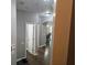 View of the hallway with hardwood floors and an open doorway to the dining room at 1067 Brownstone Dr # 23, Marietta, GA 30008