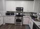 Bright, updated kitchen with stainless steel appliances, a tiled backsplash, and granite countertops at 1067 Brownstone Dr # 23, Marietta, GA 30008