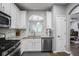 Bright kitchen with stainless appliances, granite counters, and ample cabinet space at 1067 Brownstone Dr # 23, Marietta, GA 30008