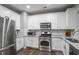 Modern kitchen featuring stainless steel appliances and white cabinetry at 1067 Brownstone Dr # 23, Marietta, GA 30008