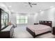 Spacious bedroom with large windows, neutral carpet, and ample closet space at 1067 Brownstone Dr # 23, Marietta, GA 30008