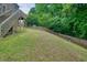 Spacious backyard with lush grass and mature trees at 2004 Spicers Ln, Woodstock, GA 30189