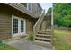 Backyard patio with stairway leading to back deck and backyard views at 2004 Spicers Ln, Woodstock, GA 30189