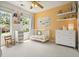 Bright Bedroom featuring a crib, shelves, and a large window with natural light at 2004 Spicers Ln, Woodstock, GA 30189
