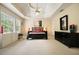Bedroom featuring natural light, a trey ceiling, and stylish decor at 2004 Spicers Ln, Woodstock, GA 30189