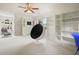 Bonus room featuring an accent chair and natural light at 2004 Spicers Ln, Woodstock, GA 30189
