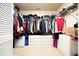 Walk-in closet with tons of storage including shelves, hanging rods, and built-in drawers at 2004 Spicers Ln, Woodstock, GA 30189