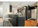 Modern kitchen features stainless steel appliances, granite countertops, and track lighting at 2004 Spicers Ln, Woodstock, GA 30189