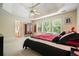 Main bedroom featuring a trey ceiling, walk-in bathroom, and natural light at 2004 Spicers Ln, Woodstock, GA 30189