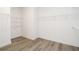 Spacious walk-in closet with wire shelving and modern wood-look flooring provides ample storage space at 2117 Ella Springs Dr, Covington, GA 30014