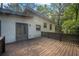Back deck with the backyard surrounded by green trees at 2575 Flagstone Se Dr, Atlanta, GA 30316