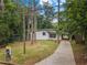 Charming one-story home with a long driveway and a well-maintained lawn at 2575 Flagstone Se Dr, Atlanta, GA 30316