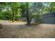 Attached garage with a long, expansive concrete driveway that is surrounded by trees, adding privacy at 2575 Flagstone Se Dr, Atlanta, GA 30316