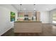 Kitchen featuring a large island with stone countertop, stainless steel appliances, and modern lighting at 2575 Flagstone Se Dr, Atlanta, GA 30316