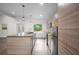 Bright kitchen featuring stainless steel appliances, a spacious island, and a view to the backyard at 2575 Flagstone Se Dr, Atlanta, GA 30316