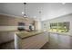 Spacious kitchen features stainless steel appliances, an island with bar seating, and wood floors at 2575 Flagstone Se Dr, Atlanta, GA 30316
