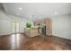 Open kitchen with stainless appliances, island with sink, and eat-in dining area with backyard access at 2575 Flagstone Se Dr, Atlanta, GA 30316