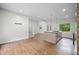 Bright, open-concept living room with hardwood floors, island, and large windows at 2575 Flagstone Se Dr, Atlanta, GA 30316