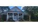 Clubhouse featuring manicured landscaping, a covered entry, and a symmetrical facade at 3613 Tinsley Sw Way, Atlanta, GA 30331
