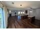 Bright kitchen connected to the living room, offering dark cabinets, an island, and an inviting open-concept layout at 3613 Tinsley Sw Way, Atlanta, GA 30331