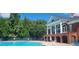 Community pool area with comfortable lounge chairs and lots of shade, perfect for relaxation at 3613 Tinsley Sw Way, Atlanta, GA 30331