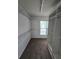 Spacious walk-in closet with shelving, hanging rods, and window providing natural light at 3613 Tinsley Sw Way, Atlanta, GA 30331
