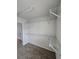 Bright walk-in closet featuring carpeted floors and ample shelving space for organized storage at 3613 Tinsley Sw Way, Atlanta, GA 30331