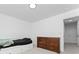 Modern bedroom with a built-in bed, dark wood dresser, and neutral color palette at 3993 Makeover Ct, South Fulton, GA 30349