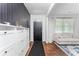 Inviting entryway with hardwood floors, stylish storage, and a cozy seating area at 3993 Makeover Ct, South Fulton, GA 30349