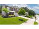 Beautifully landscaped home with a lush green lawn and an extended driveway at 3993 Makeover Ct, South Fulton, GA 30349