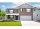 Charming two-story brick home featuring a well-manicured lawn and attached two-car garage at 3993 Makeover Ct, South Fulton, GA 30349