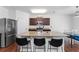 Modern kitchen with stainless steel appliances, a granite island, and breakfast bar seating at 3993 Makeover Ct, South Fulton, GA 30349