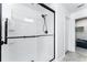 Modern shower with glass enclosure, white subway tile, and black hardware at 3993 Makeover Ct, South Fulton, GA 30349