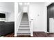 Carpeted staircase leading to the upper level with modern decor at 3993 Makeover Ct, South Fulton, GA 30349
