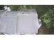 Aerial view of the roof of a two-story townhome surrounded by lush green trees at 1104 Huntington Se Trce, Smyrna, GA 30082