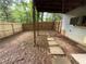 Covered backyard with fence and a pathway of paving stones at 1104 Huntington Se Trce, Smyrna, GA 30082
