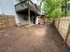 Backyard featuring a wooden fence and view of a second story deck at 1104 Huntington Se Trce, Smyrna, GA 30082